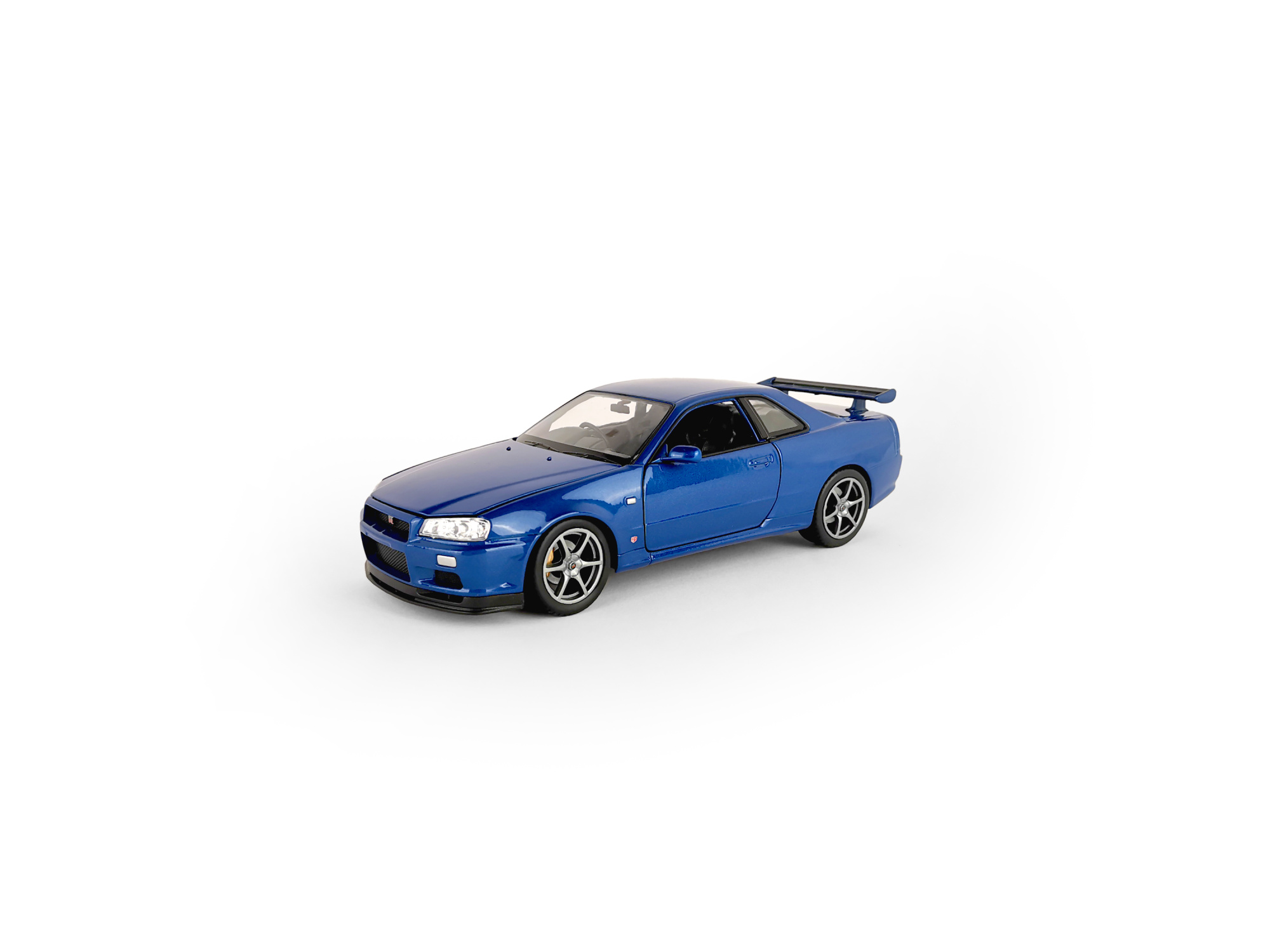 Машинка WELLY 1:24 Nissan Skyline GT-R R34, синий