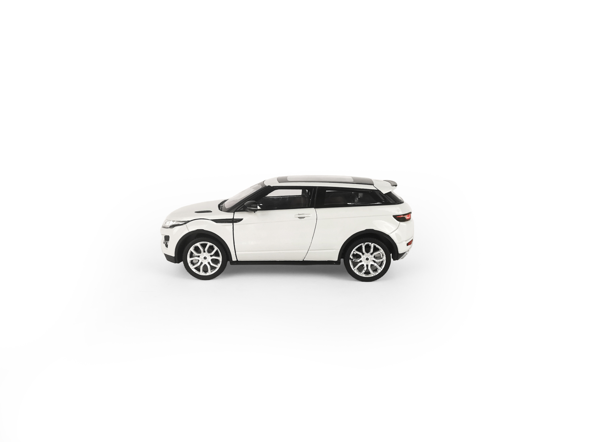 Машинка WELLY 1:24 Range Rover Evoque, белый Машинка WELLY 1:24 Range Rover Evoque, белый